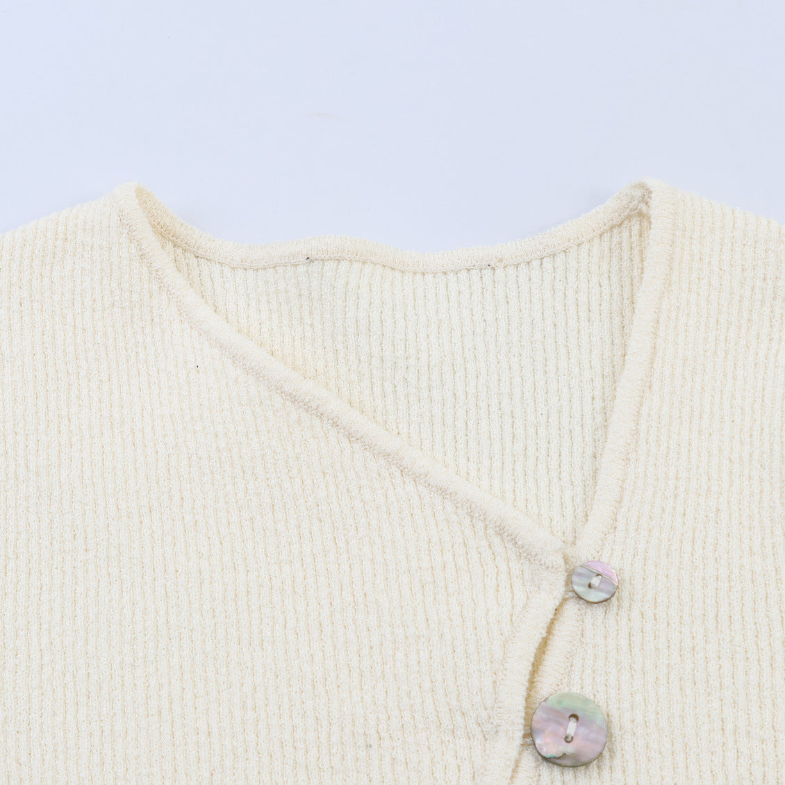 Asymmetric buckle knitted jacket