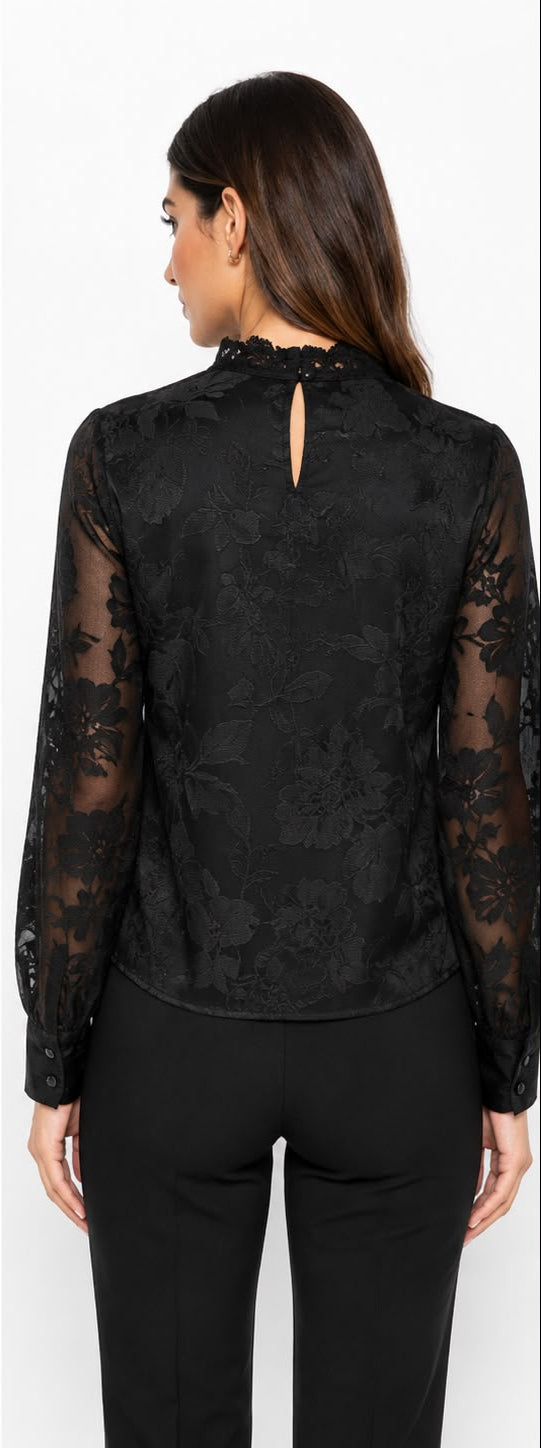 A woman modeling a black long-sleeve blouse with sheer floral lace sleeves and a high ruffled neckline, shown from both the front and back views against a plain white background.