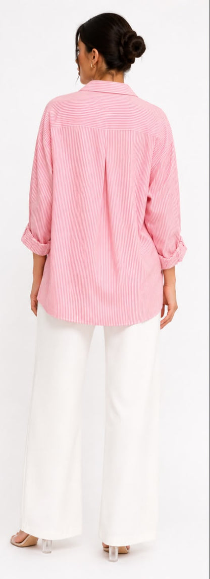 Woman wearing a pink shirt and white pants, shown from front and back on a white background.