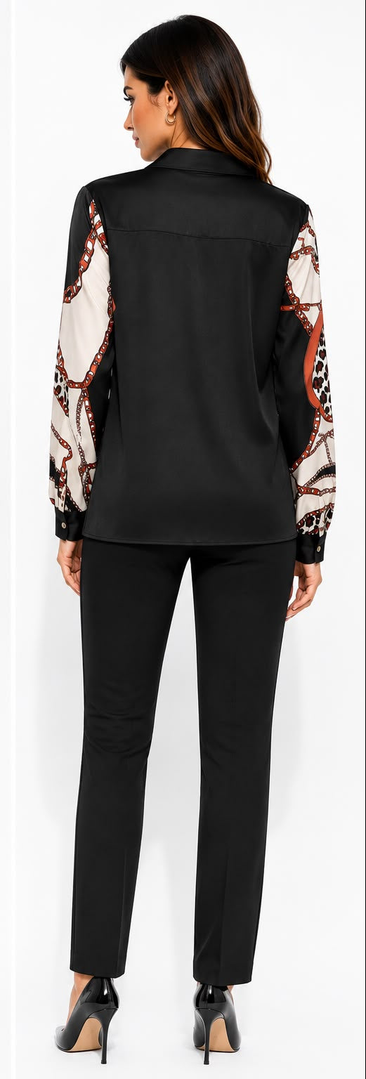 A woman modeling a black long-sleeve collared blouse with abstract and animal-print patterned sleeves and hem, paired with black pants and heels, shown in front and back views against a light gray studio background.