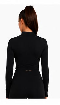 Ziba Couture black zip-up long sleeve top with product details and images on a website page.